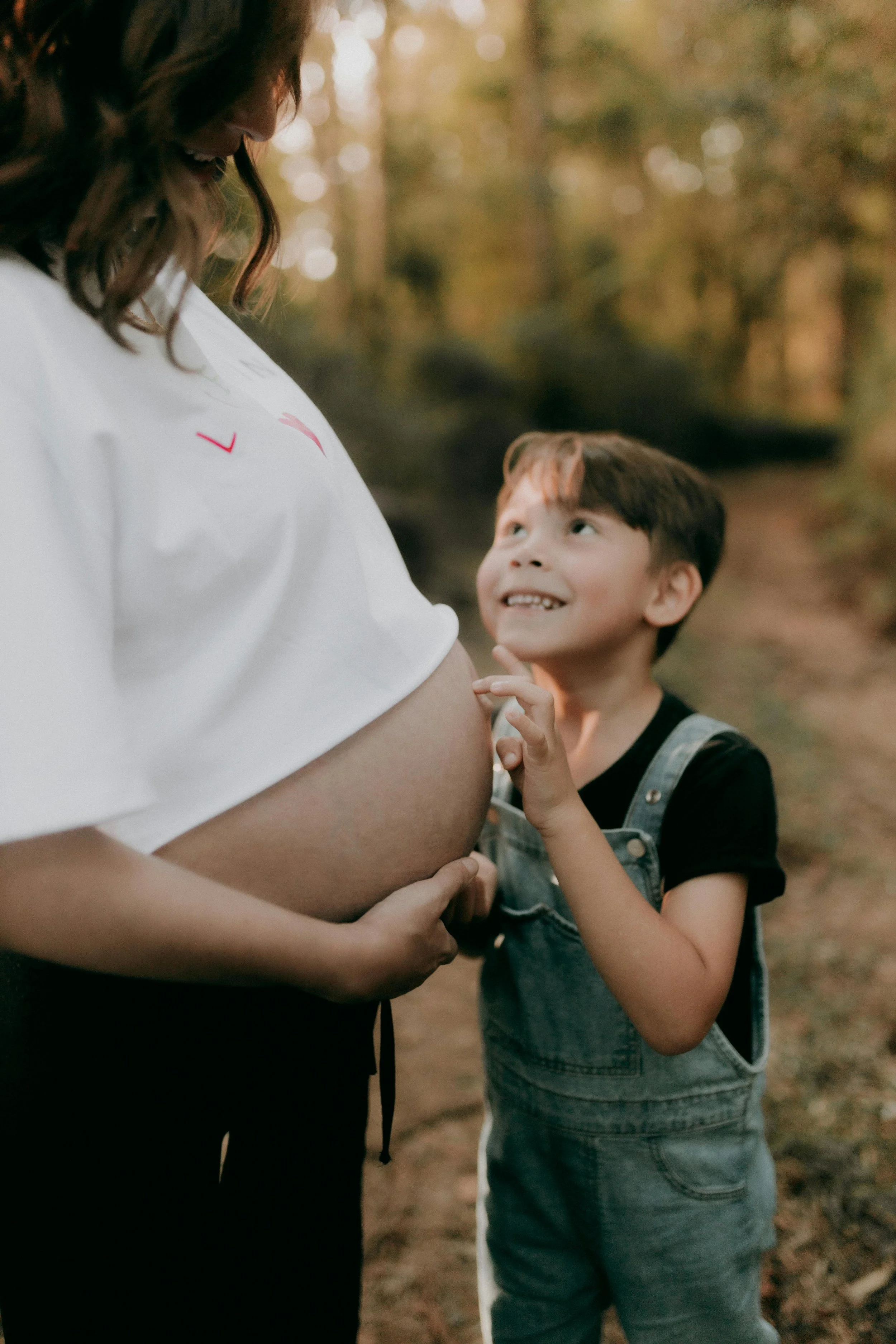 son touching moms belly