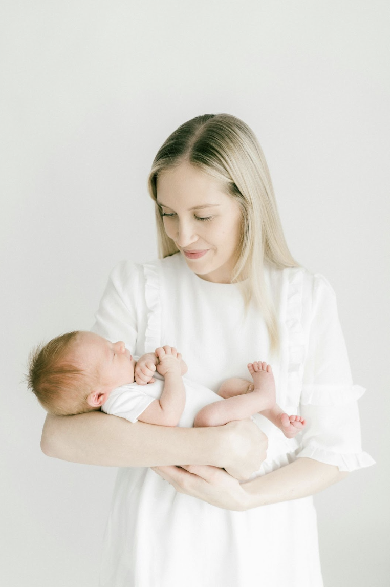 mom holding baby
