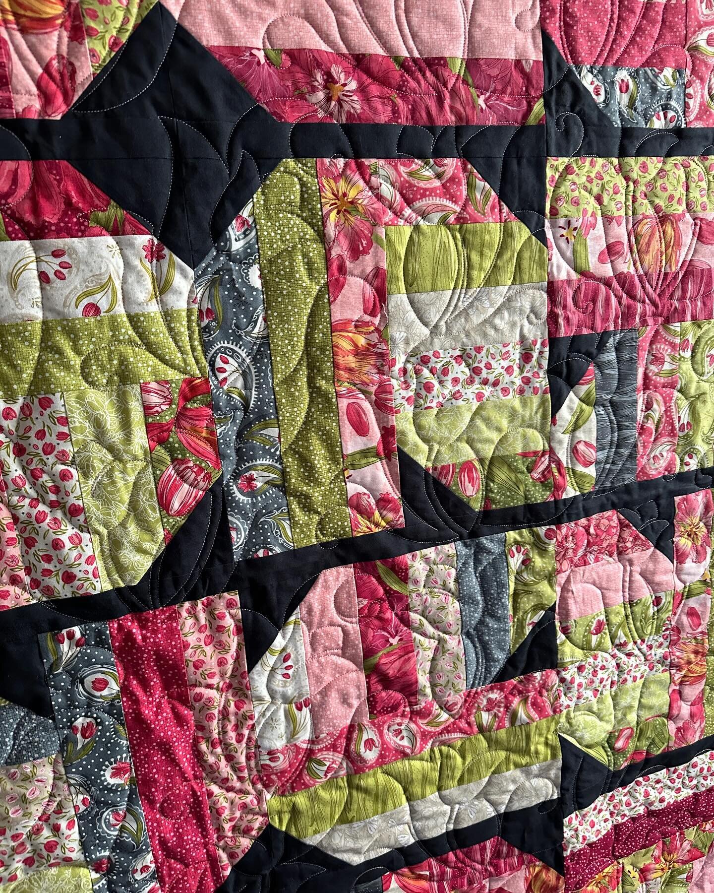 What&rsquo;s better than a lovely quilt to keep you cozy on a winters day? A springtime inspired quilt! This quilt pattern is a modern tulip, and we quilted it with tulips and warm gray cuddle. 
What types of flowers would you like to see quilted? Te