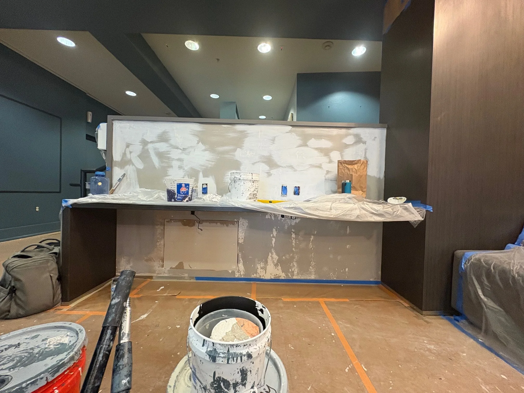 Interior painting and wallpaper installation at high‑end apartment building in downtown Portland, Oregon.