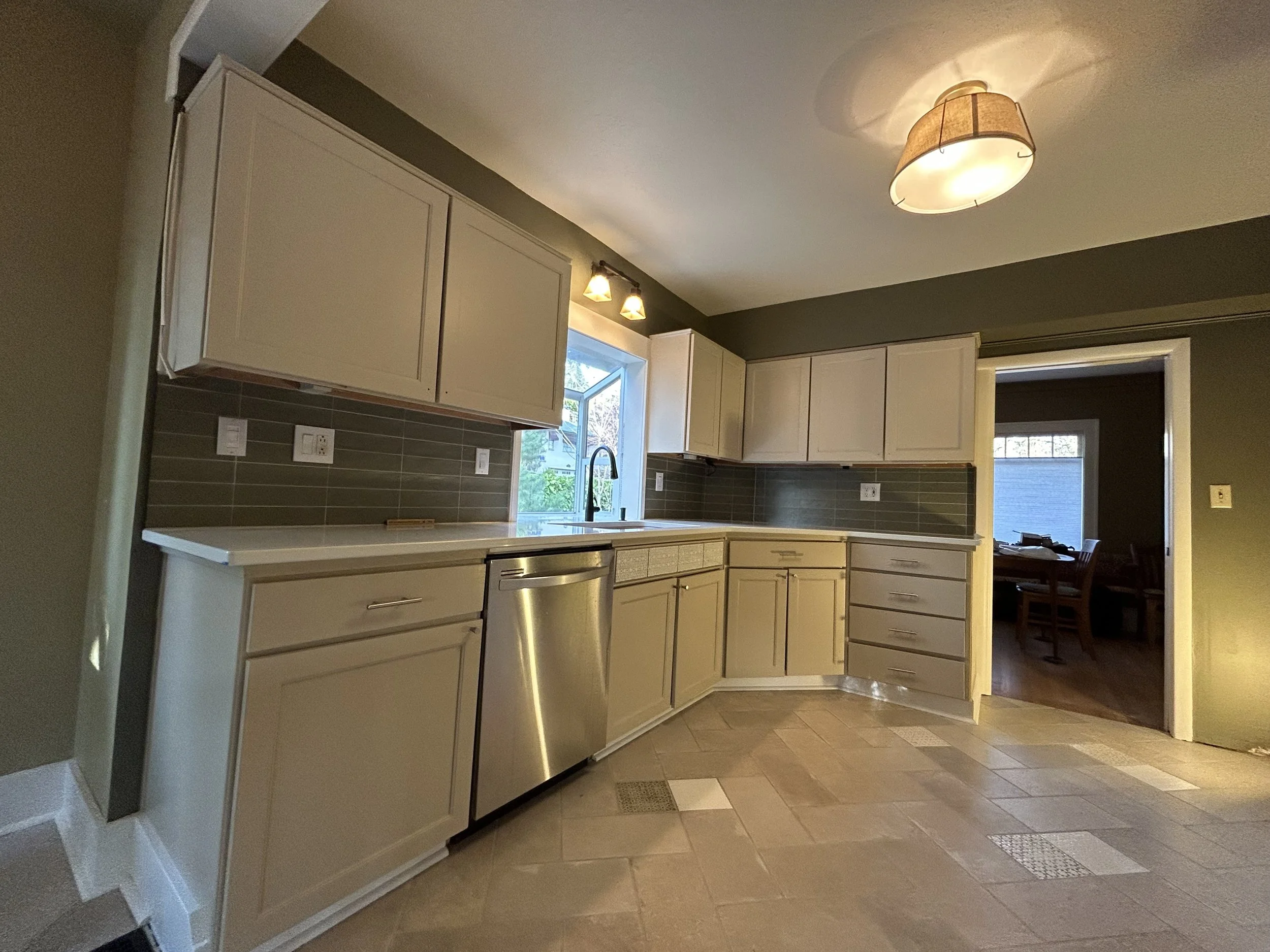 Kitchen interior painting in East Portland showing painted cabinets, walls, and ceilings finished with Sherwin‑Williams enamel by Certified Painting & Contracting.