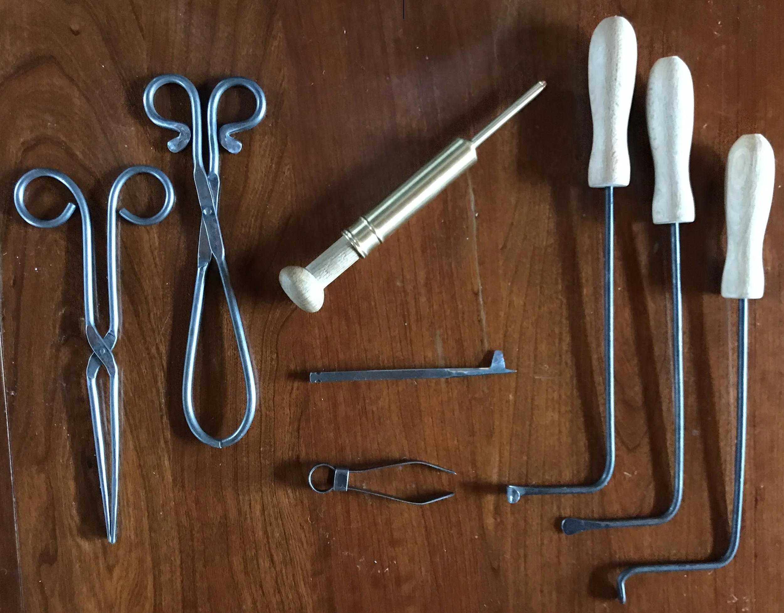 From Left to Right: Pliers, clamps, clyster, blood letting fleem, small clamp, cautery instruments