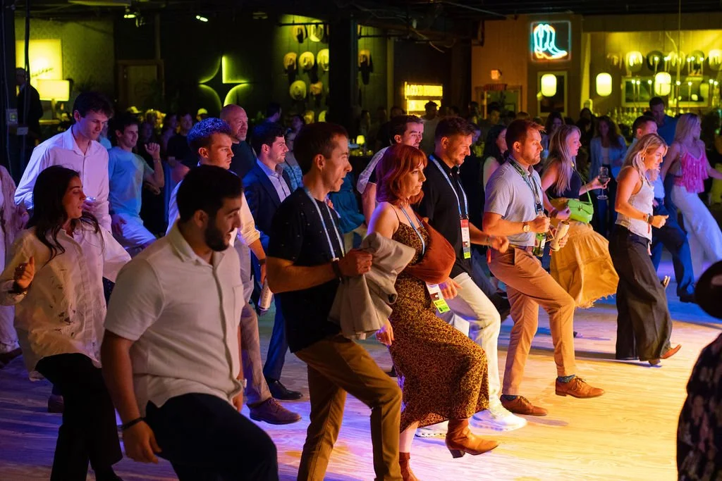 A group of guests joining the line-dancing activity at The Outlawyer.