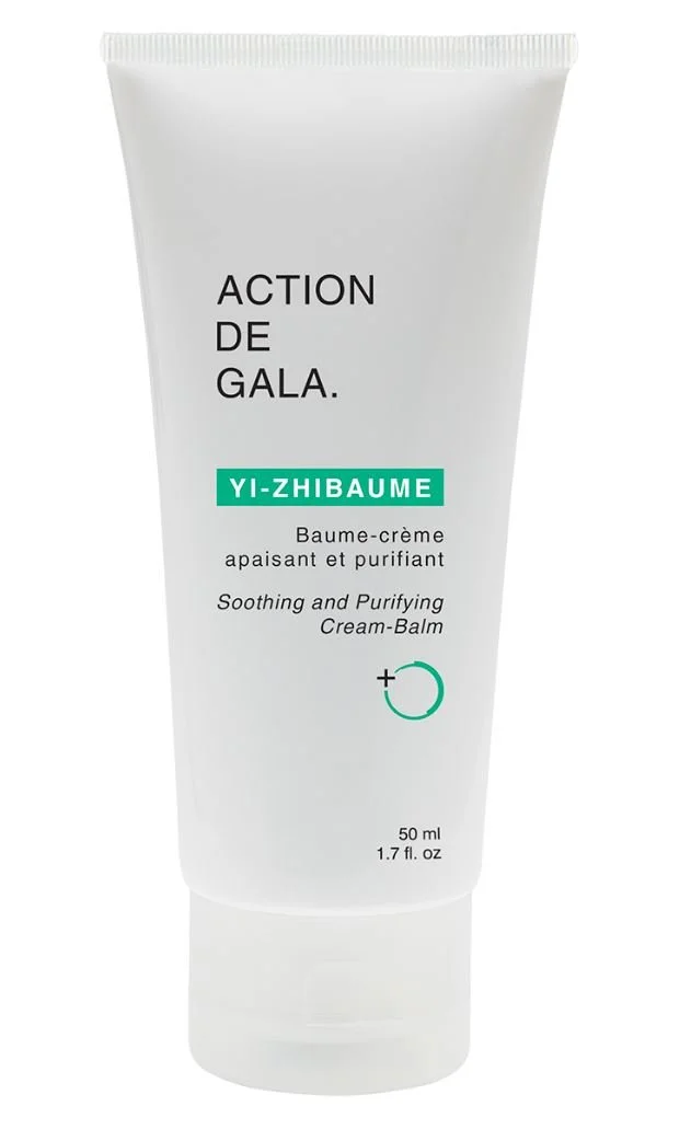 A white tube of Action de Gala YI-Zhibaume soothing and purifying cream-balm with black text and green accents.
