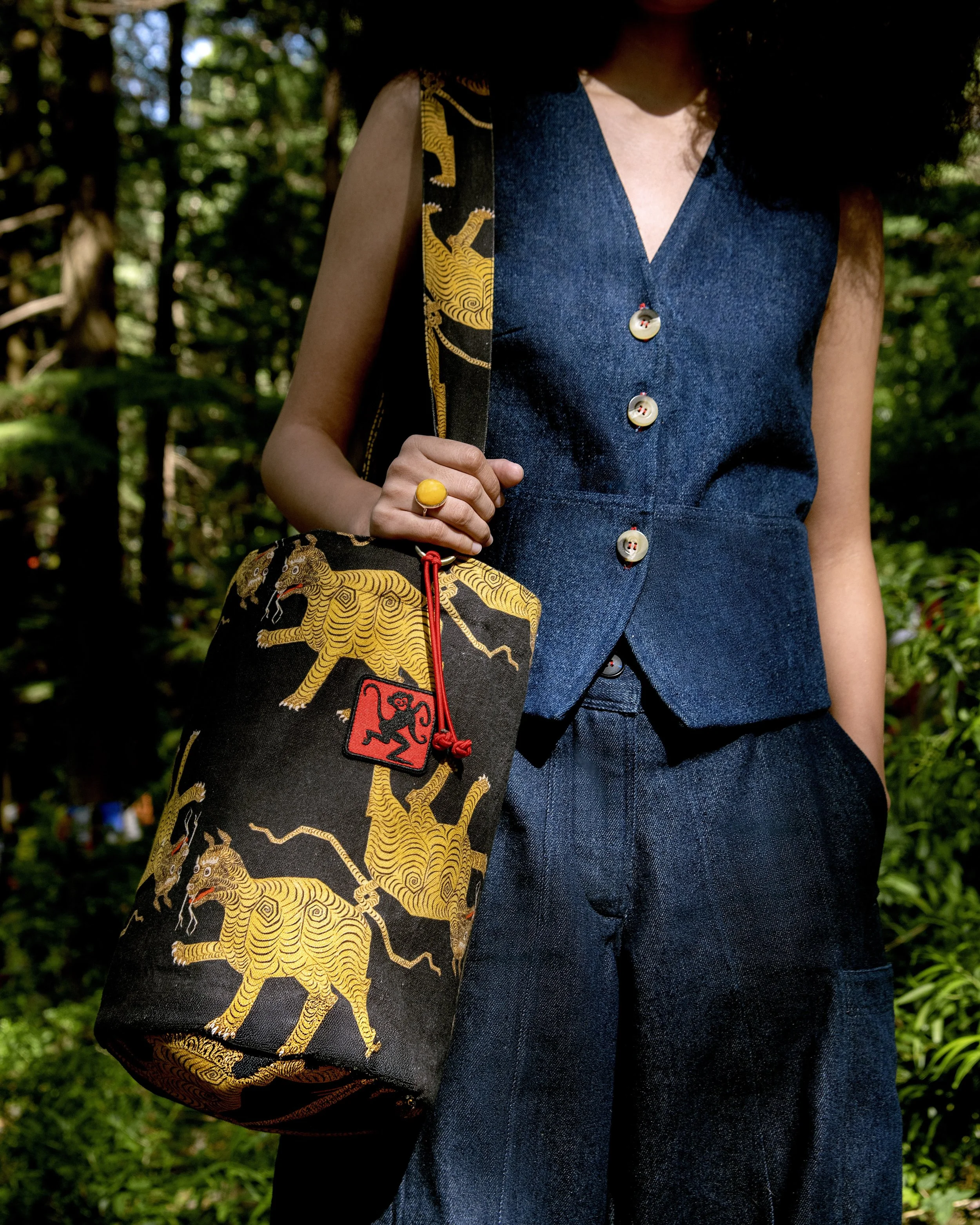 Black Tiger Bucket Bag and Denim Women's Vest by slow fashion Tibetan art brand Studio Losel