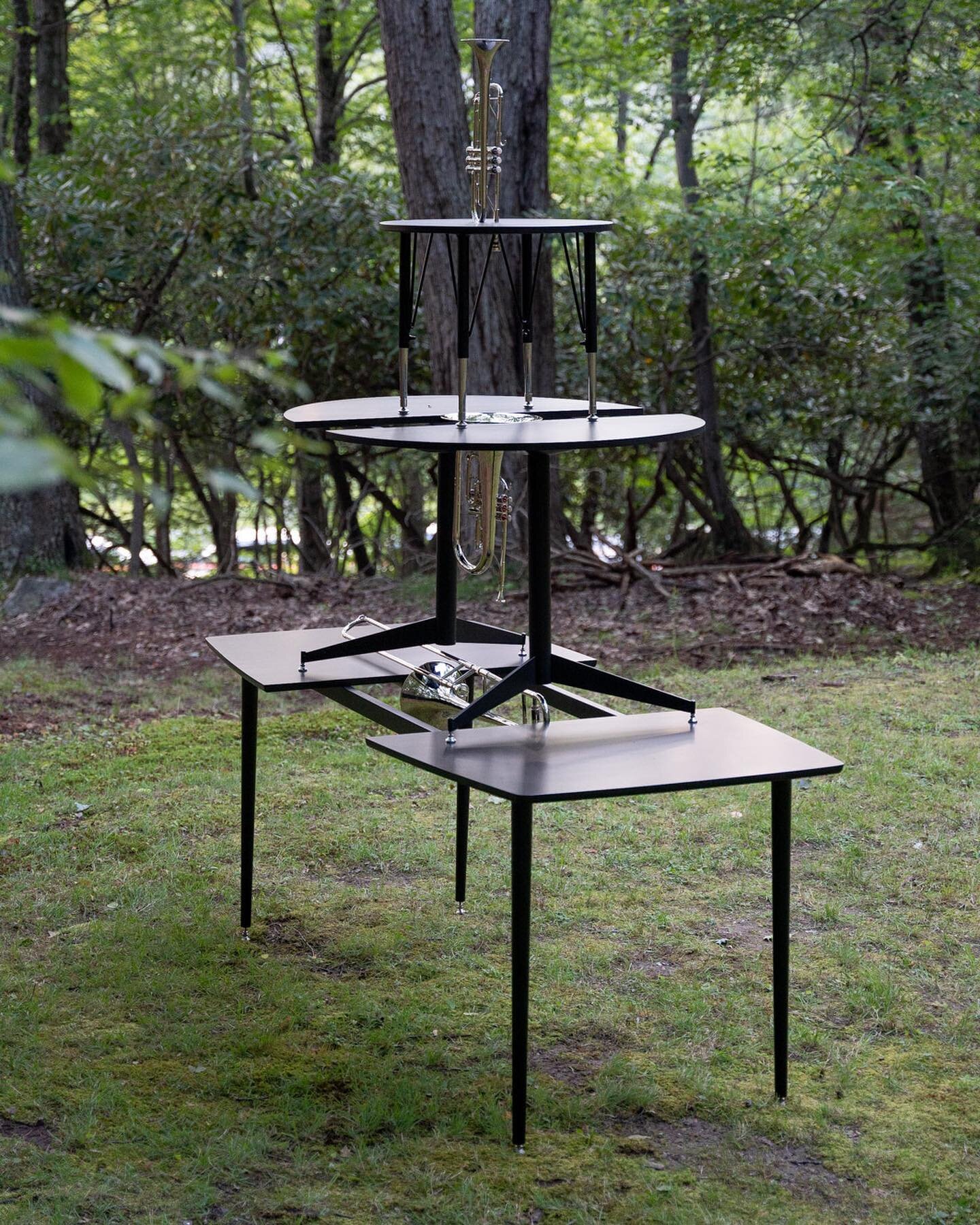 Christine Rebhuhn&rsquo;s sculpture stood on the left end of The Clearing. The slick black tables appeared alien against the wooded backdrop while the silver chrome instruments (and mouth-piece-like table feet) mirrored their surroundings.

Christine