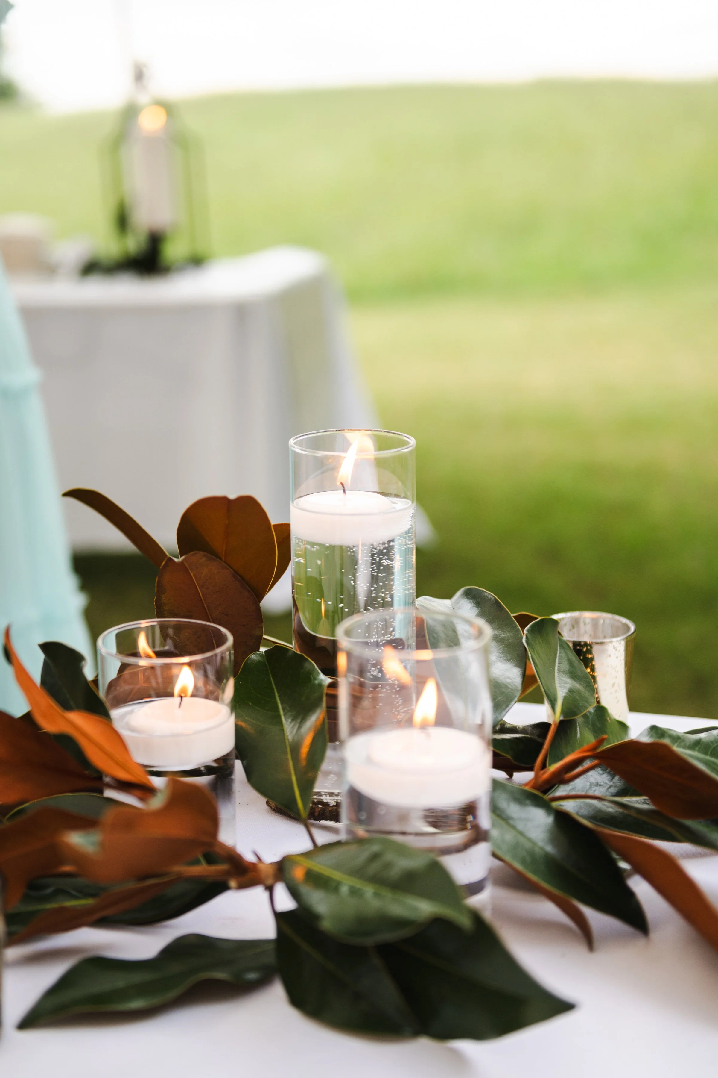 Table Centerpiece with floating candles and Magnolia Leaves