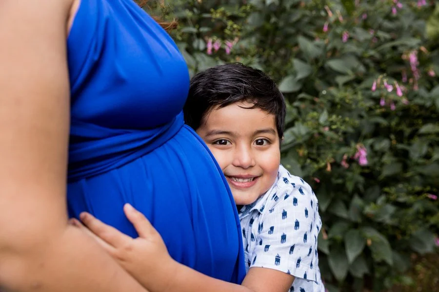Mother and son sharing a joyful moment in North Sydney maternity photoshoot