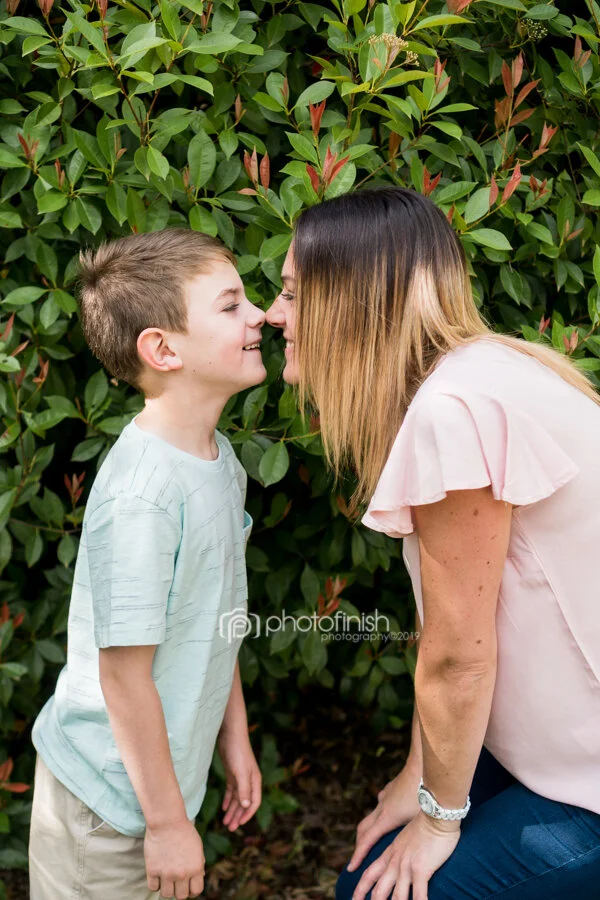 Mother and son nose kisses