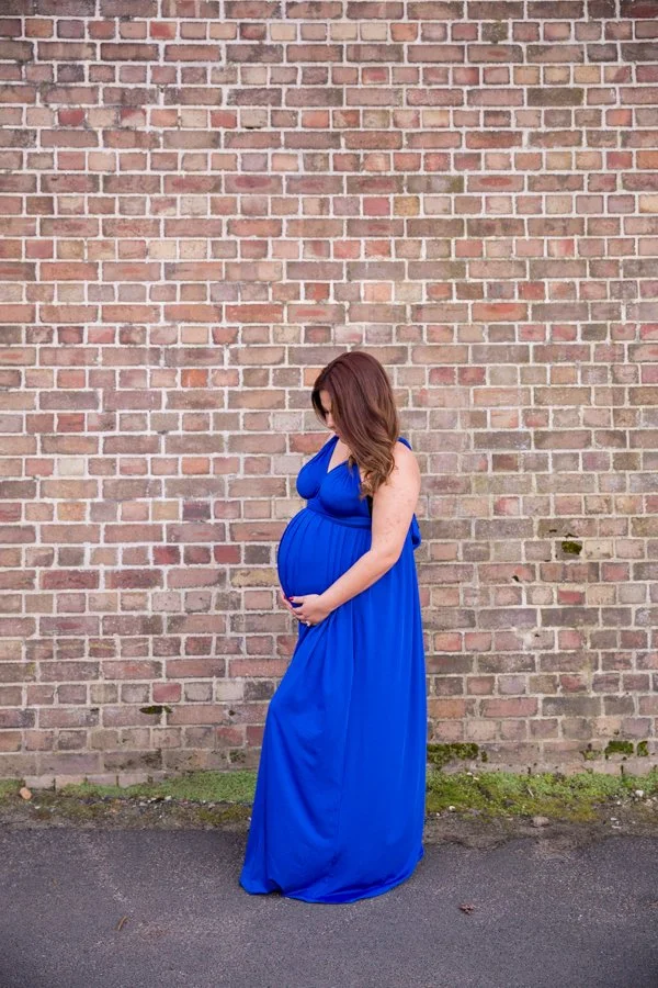 Expectant mother in royal blue gown during Lavender Bay maternity session