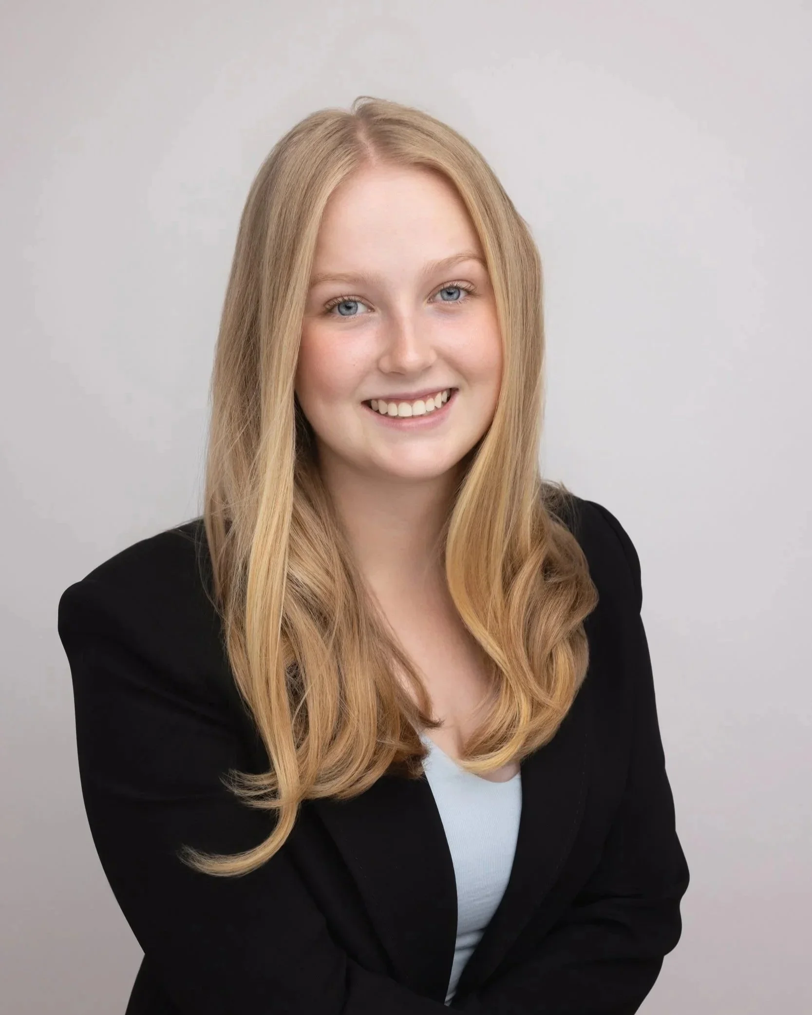 Professional headshot of female university student in black blazer for investment banking cadetship