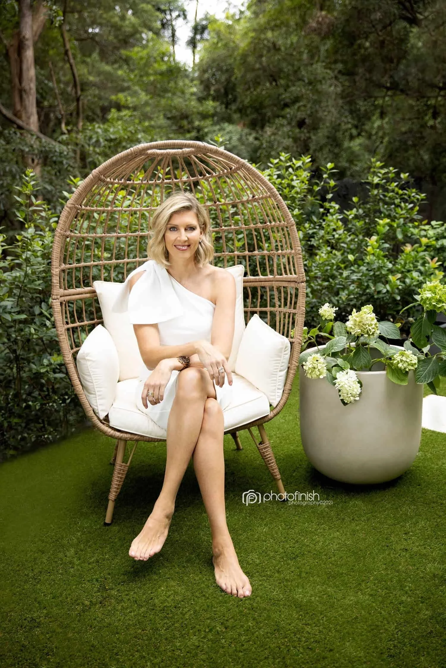 Professional woman sitting on chair in garden