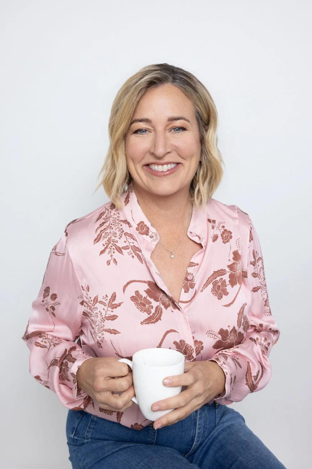 Woman in a pink floral blouse at her Modern Headshot Event session, Lane Cove, Sydney