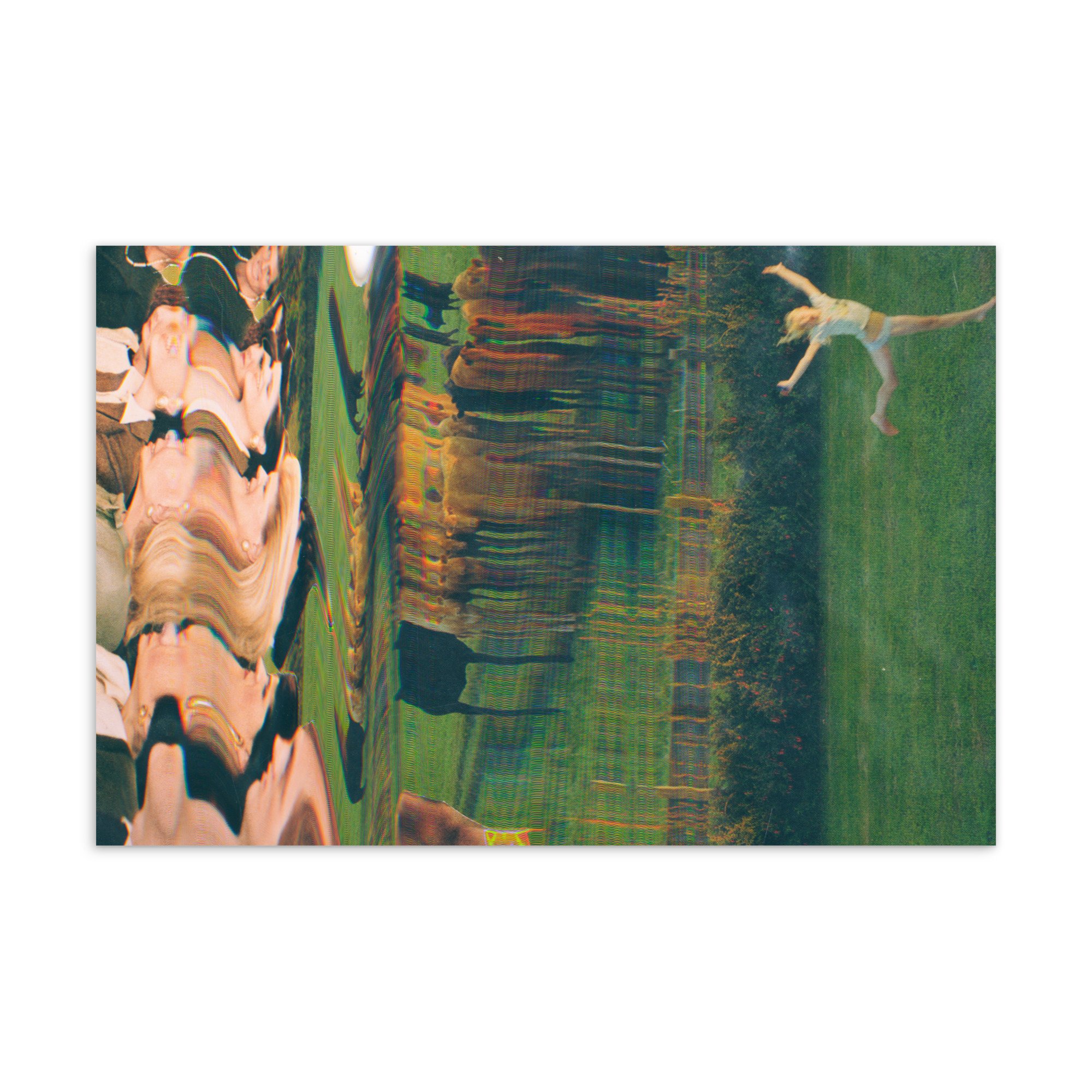 A woman dancing on a lawn with green grass, wearing a white dress, with trees and a person walking in the background.