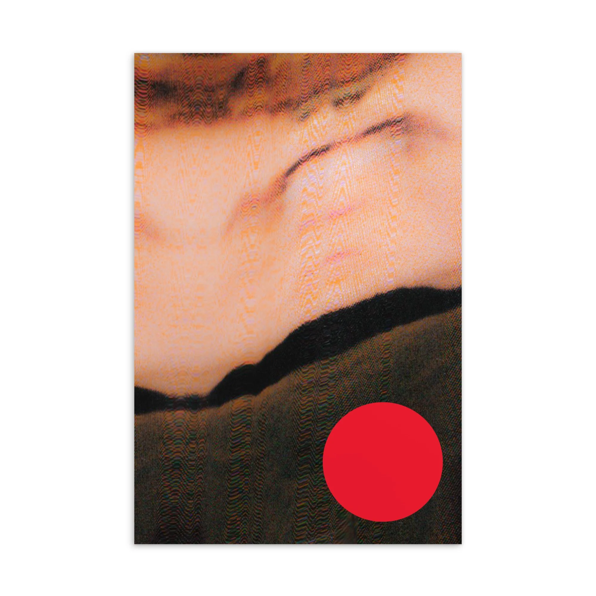 Close-up of a person with makeup, wearing dark lipstick, and a black garment with a red circle at the bottom right corner.