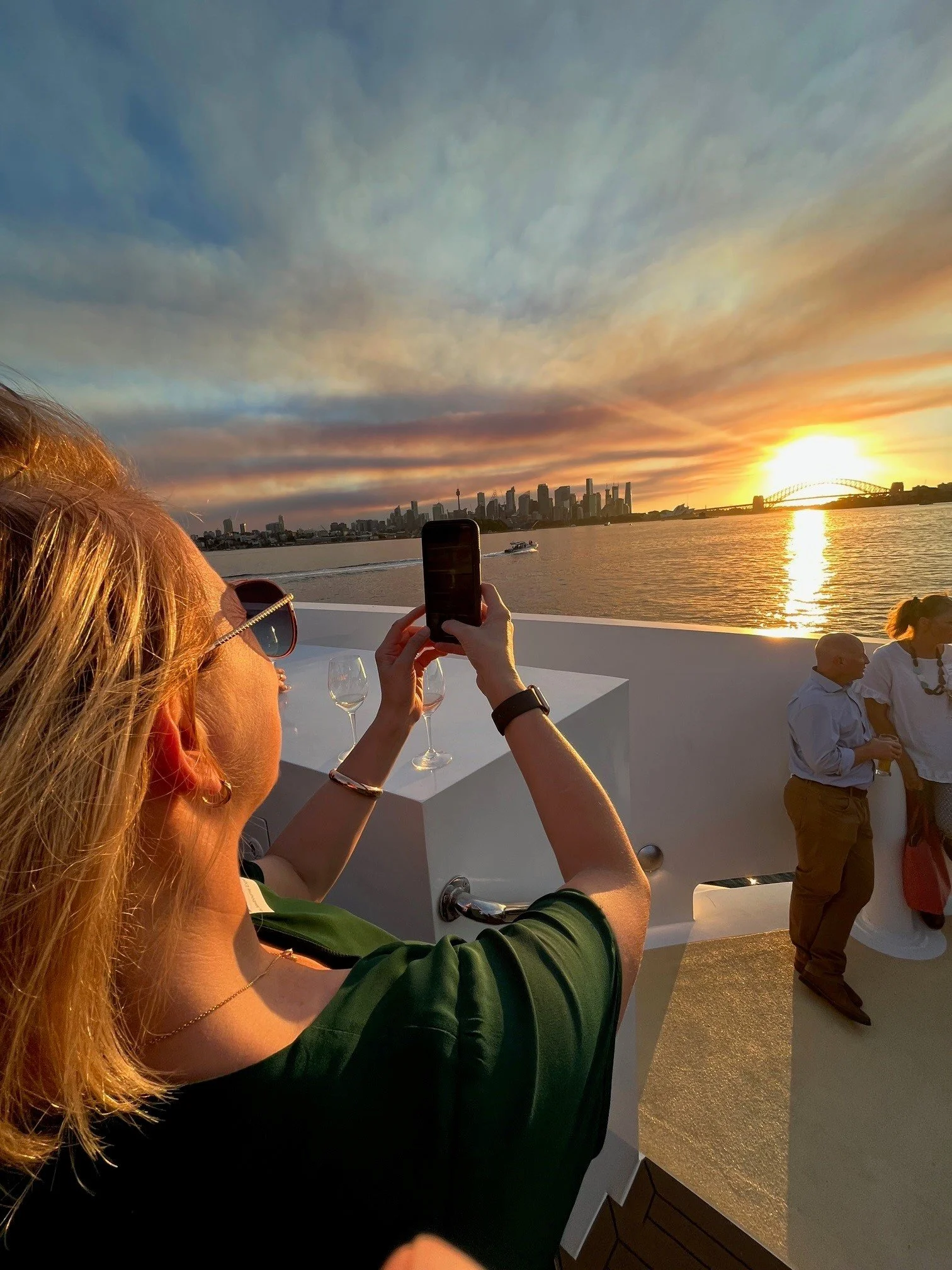 Ferry travelling across Sydney Harbour with city skyline