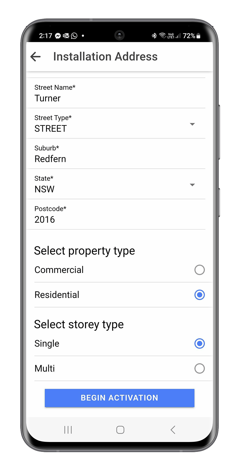 Mobile screen showing an installation address form with fields for street name, type, suburb, state, postcode, and options for property type and storey type, and a blue button labeled 'Begin Activation'.