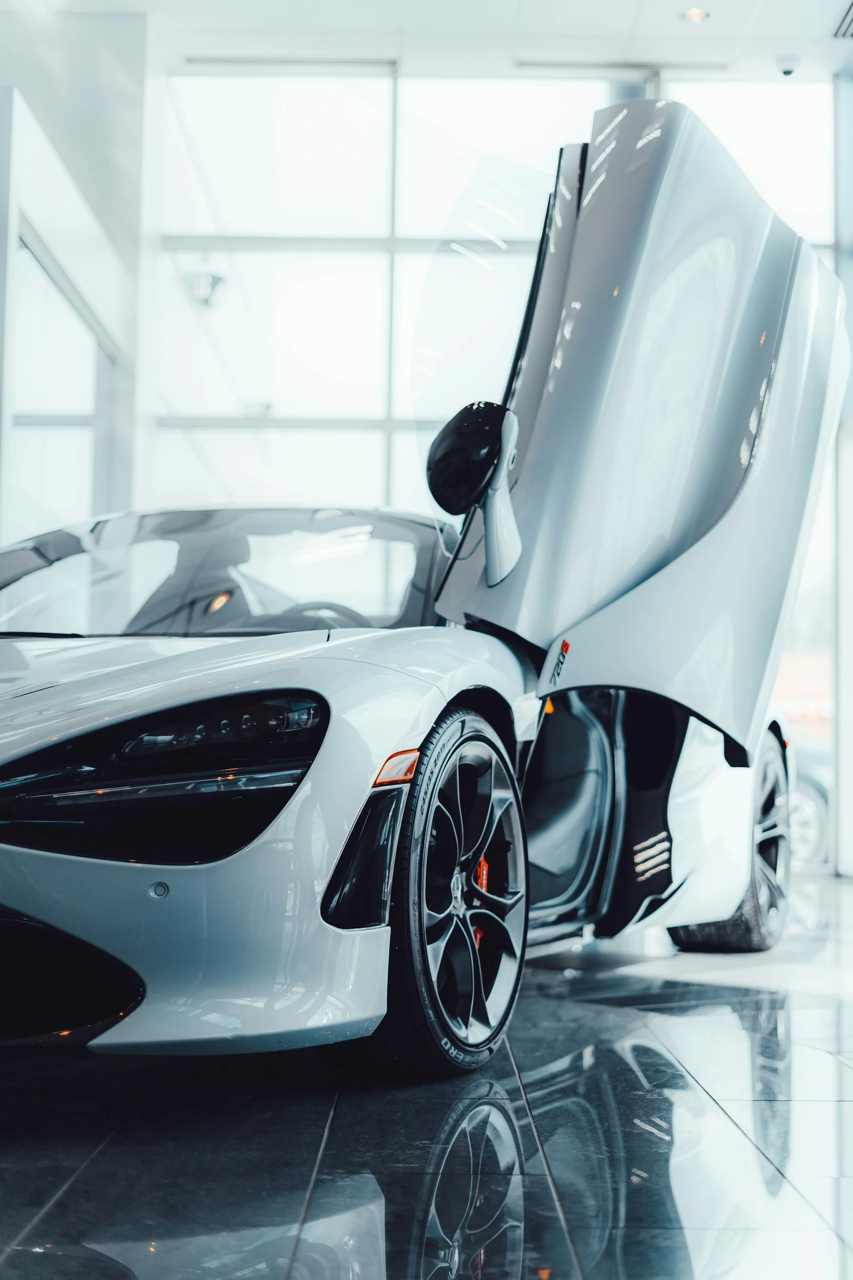 Professional paint protection film installation protecting vehicle paint from rock chips and road debris.