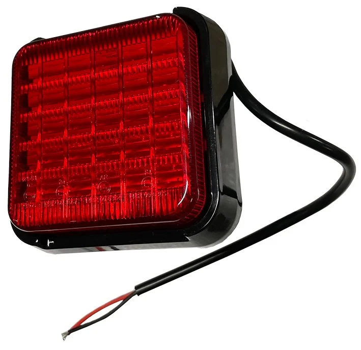 Square red LED trailer fog light with attached wiring.