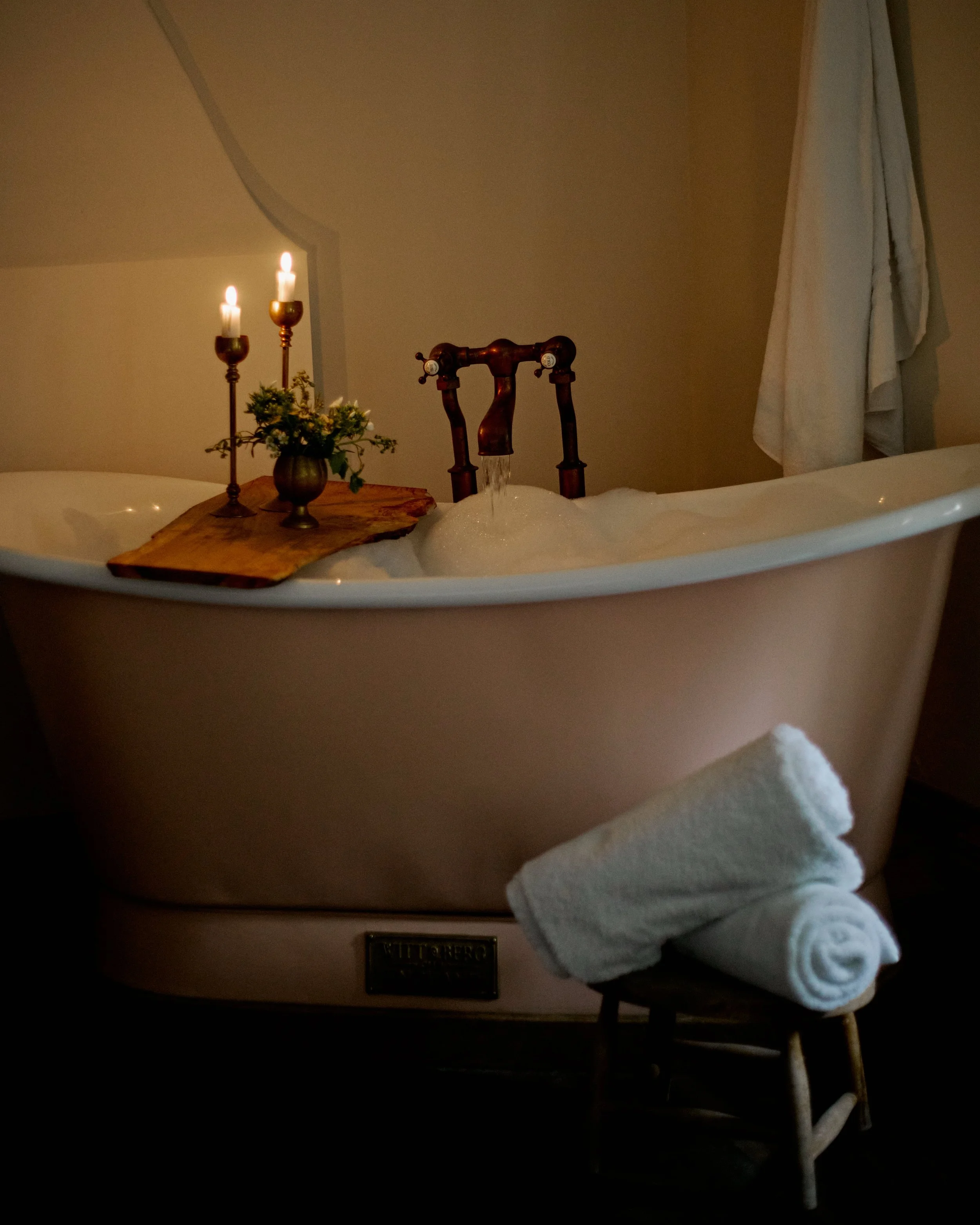 Slipper bath with candles and towels