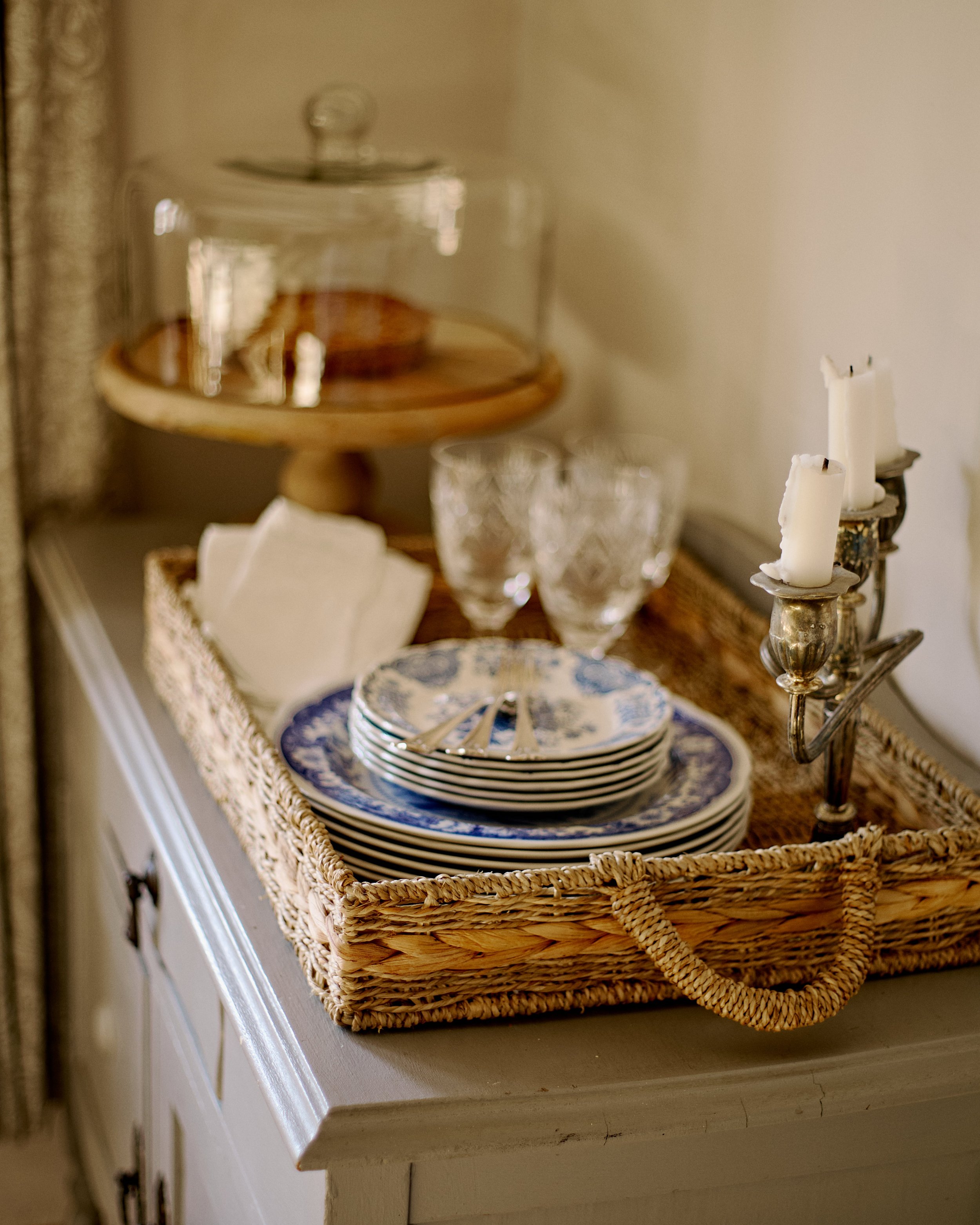 Sideboard with crockery and cake stand
