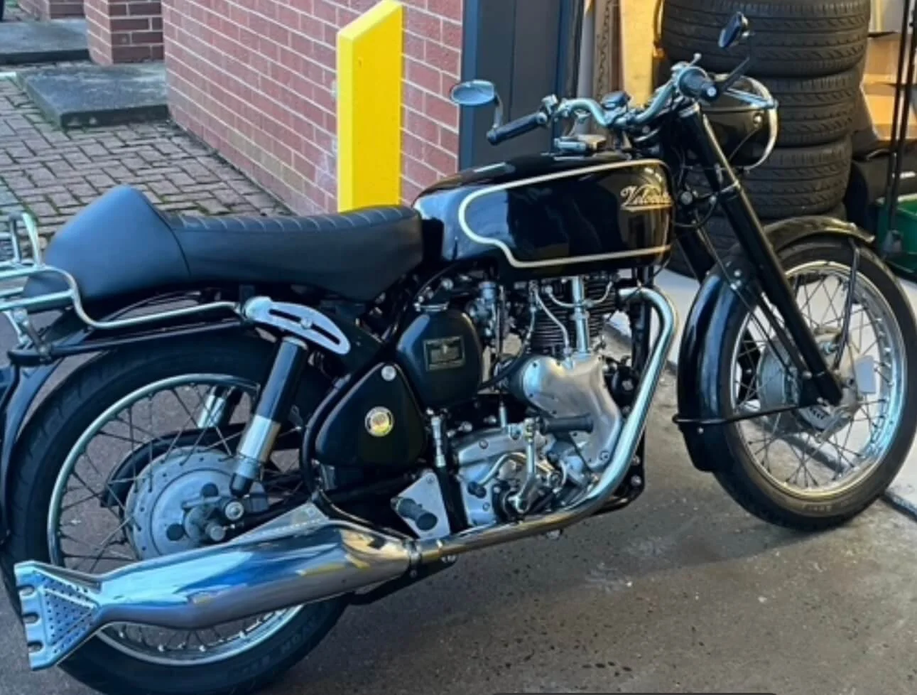 Velocette motorbike outside industrial workshop unit