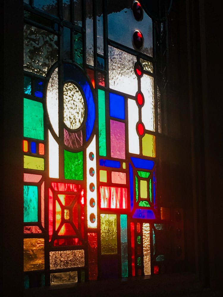 Colorful stained glass window with geometric patterns