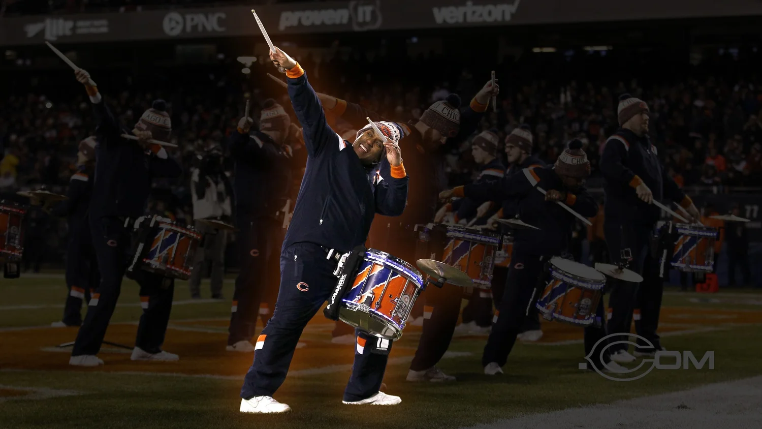 The Kung Fu DJ performing with a drum on the Chicago Bears football field