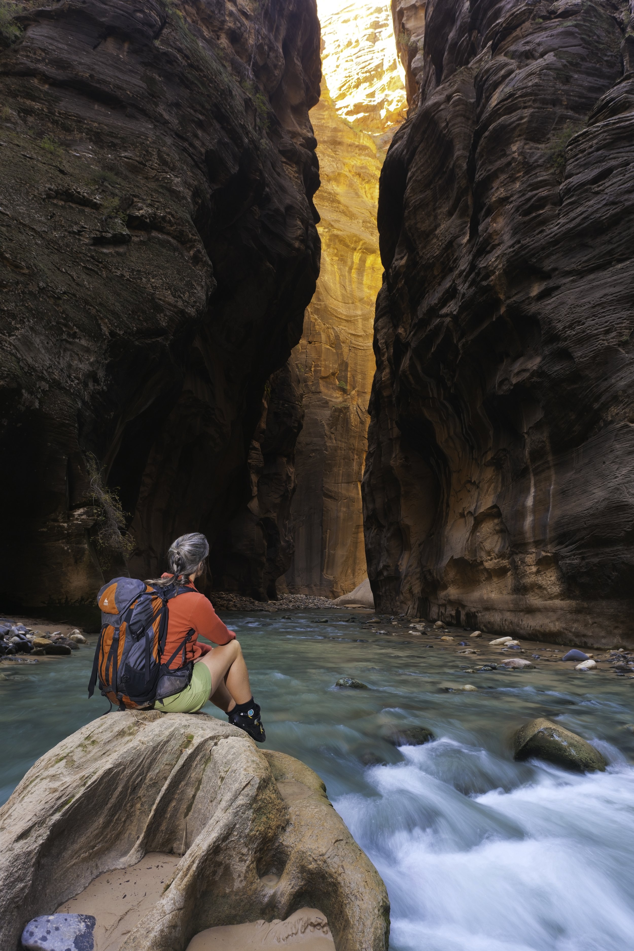 A hiker contemplates the beauty of the Zion Narrows. (Copy)