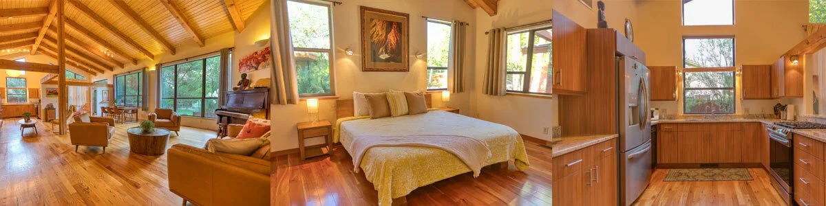 Spacious open-concept living room, bedroom, and kitchen with wooden floors and ceilings, large windows, modern furnishings, and natural lighting.