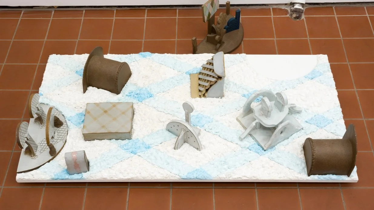 Untitled (wall-to-wall sample/toys left out)  2023  
Stoneware, sculptamold, MDF.  
10 x 48 x 25 in.