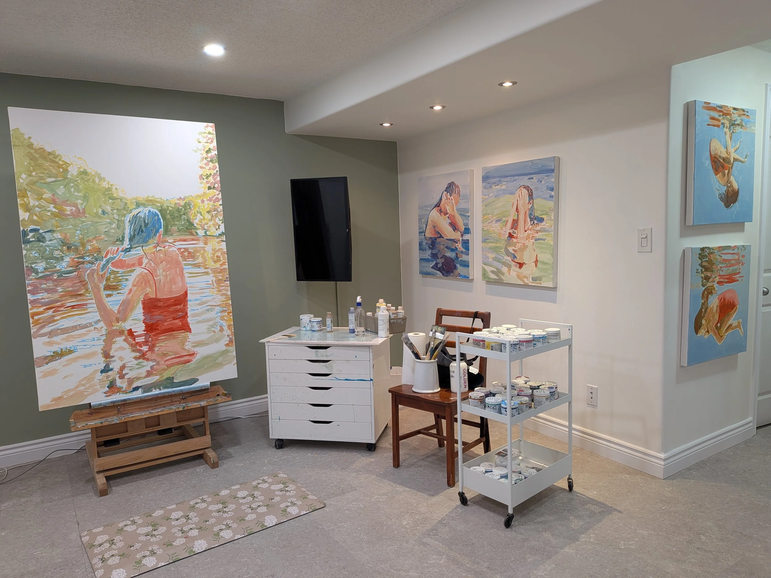 Studio of Alberta artist Vanessa Corrigall with new swimmer paintings in progress
