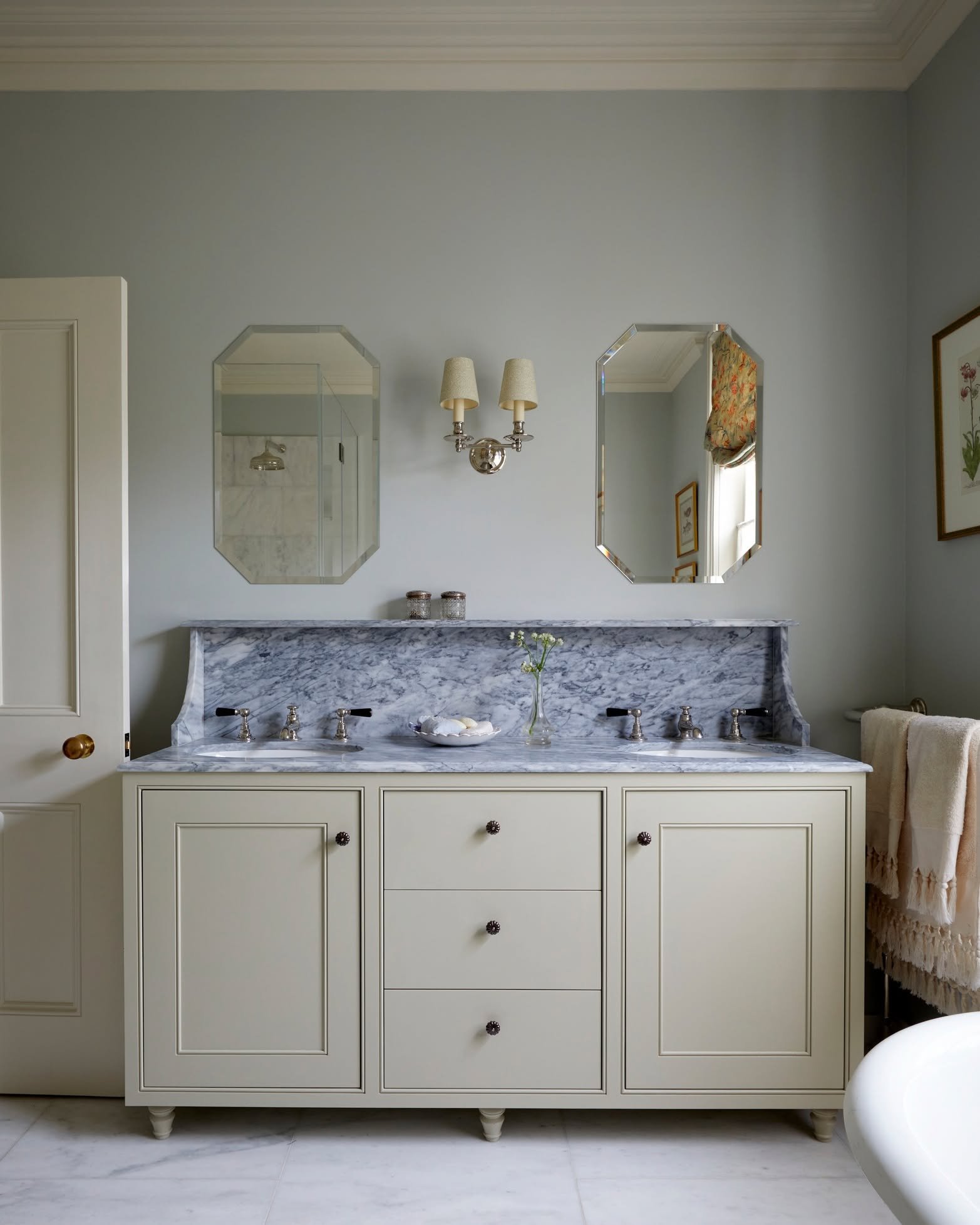 A serene bathroom in Islington with a vanity designed by us, finished off with beautiful Portuguese marble &amp; polished nickel taps 

#caveinteriors #bathroomdesign #interiordesign
