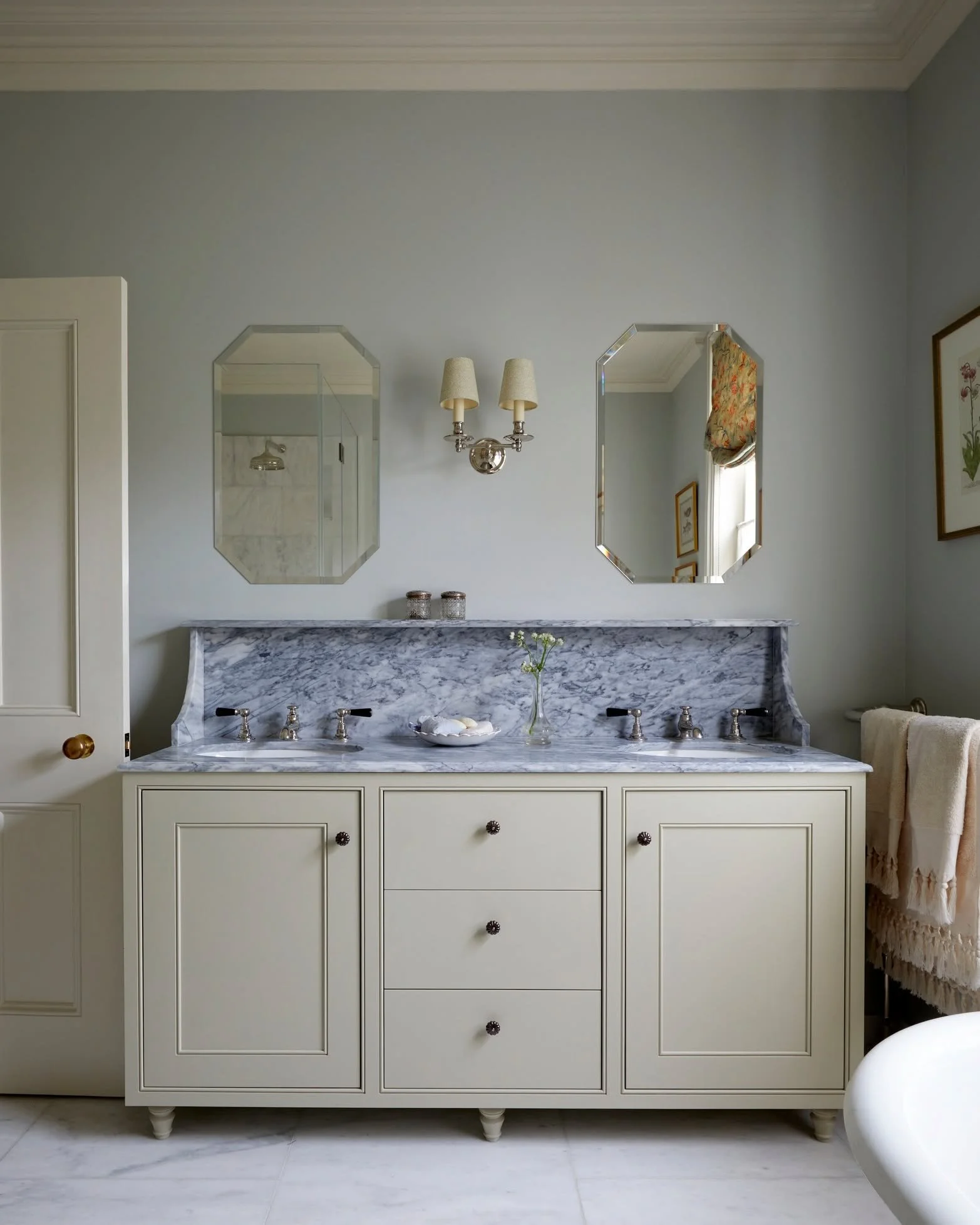 A serene bathroom in Islington with a vanity designed by us, finished off with beautiful Portuguese marble &amp; polished nickel taps 

#caveinteriors #bathroomdesign #interiordesign