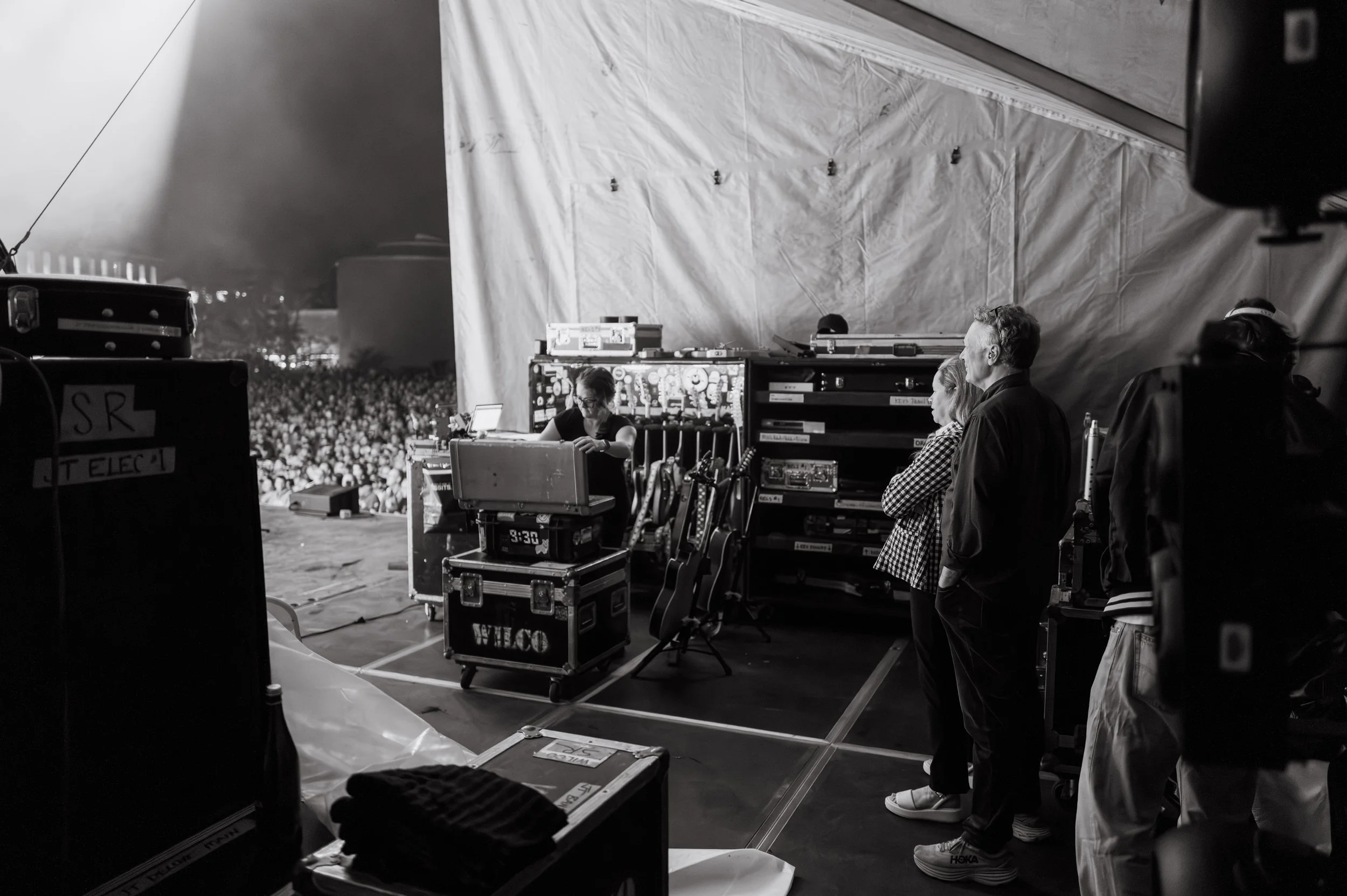 Natalie Merchant standing in a backstage before going on to join Jeff Tweedy and Billy Bragg to perform songs off the Mermaid Avenue record.
