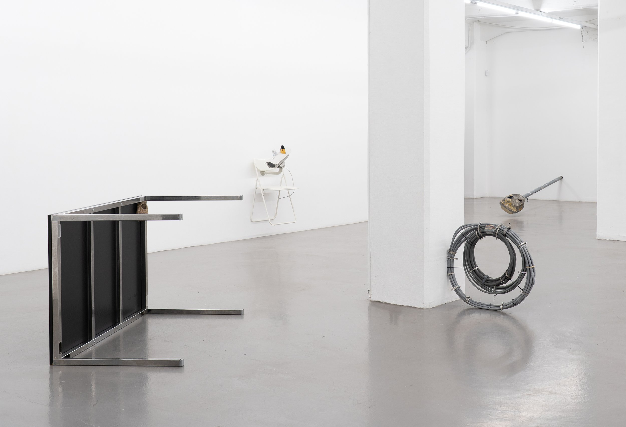 Installation view of “Three Views from a Nest,” a metal table sculpture incorporating a bird nest, receipts, and resin 3D-printed components, exhibited at Platform Stockholm.