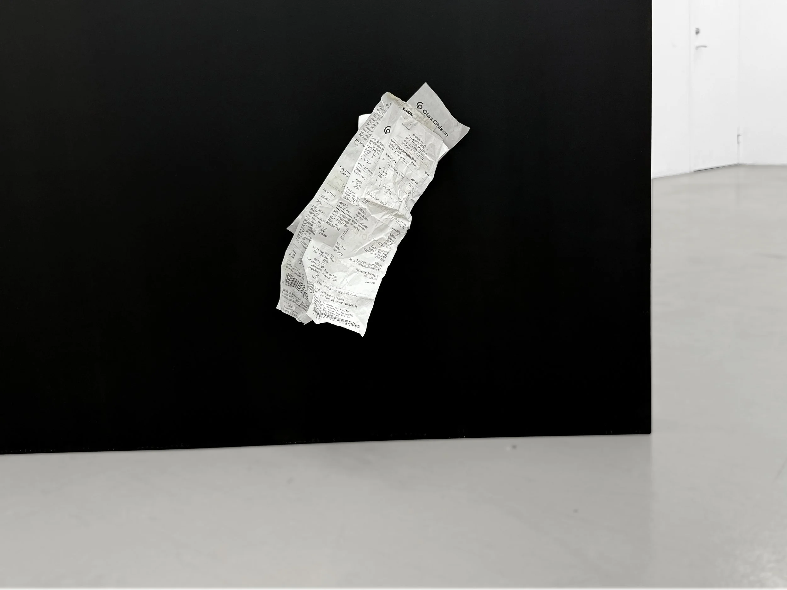 Detail of the embedded receipts attached to the sculpture “Three Views from a Nest,” photographed at Platform Stockholm.