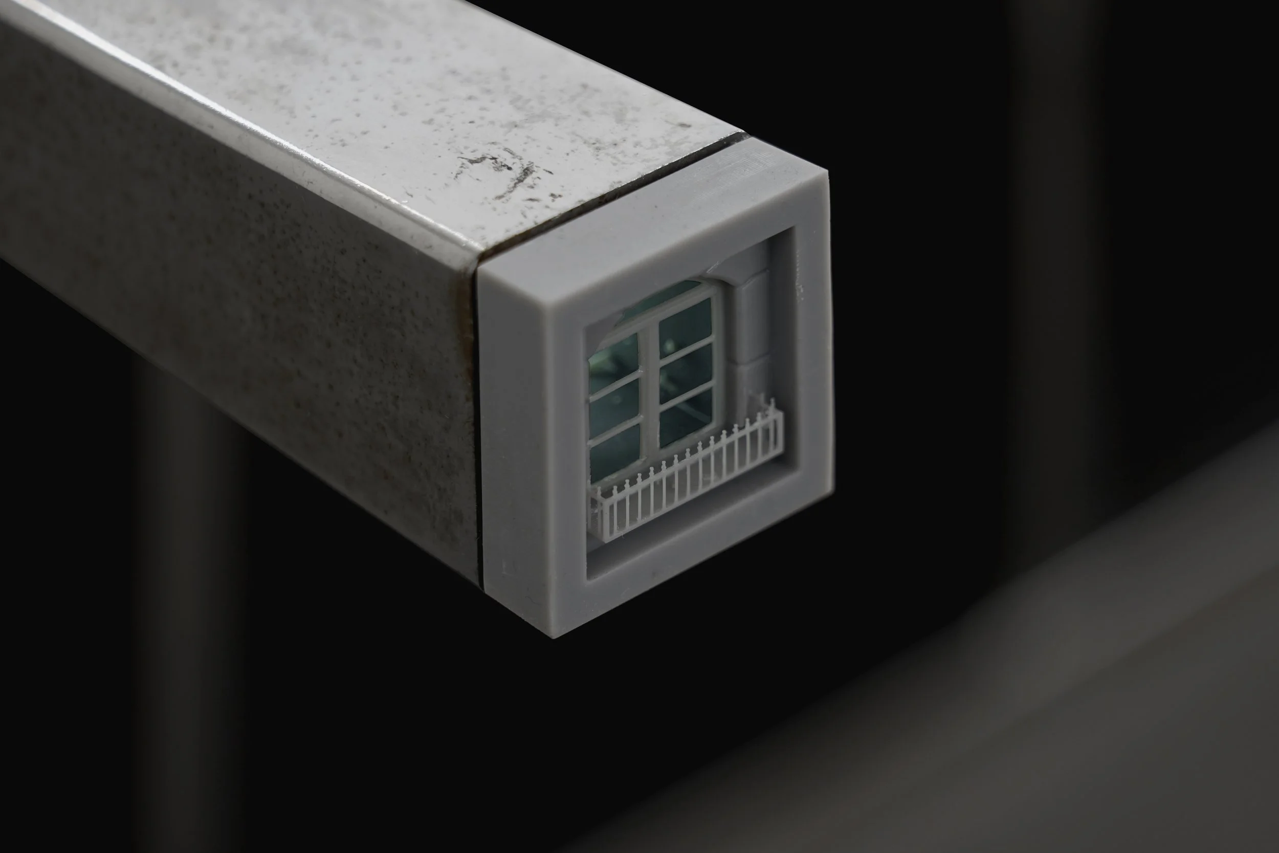 Detail of a resin 3D-printed window embedded in the structure of the sculpture “Three Views from a Nest.”