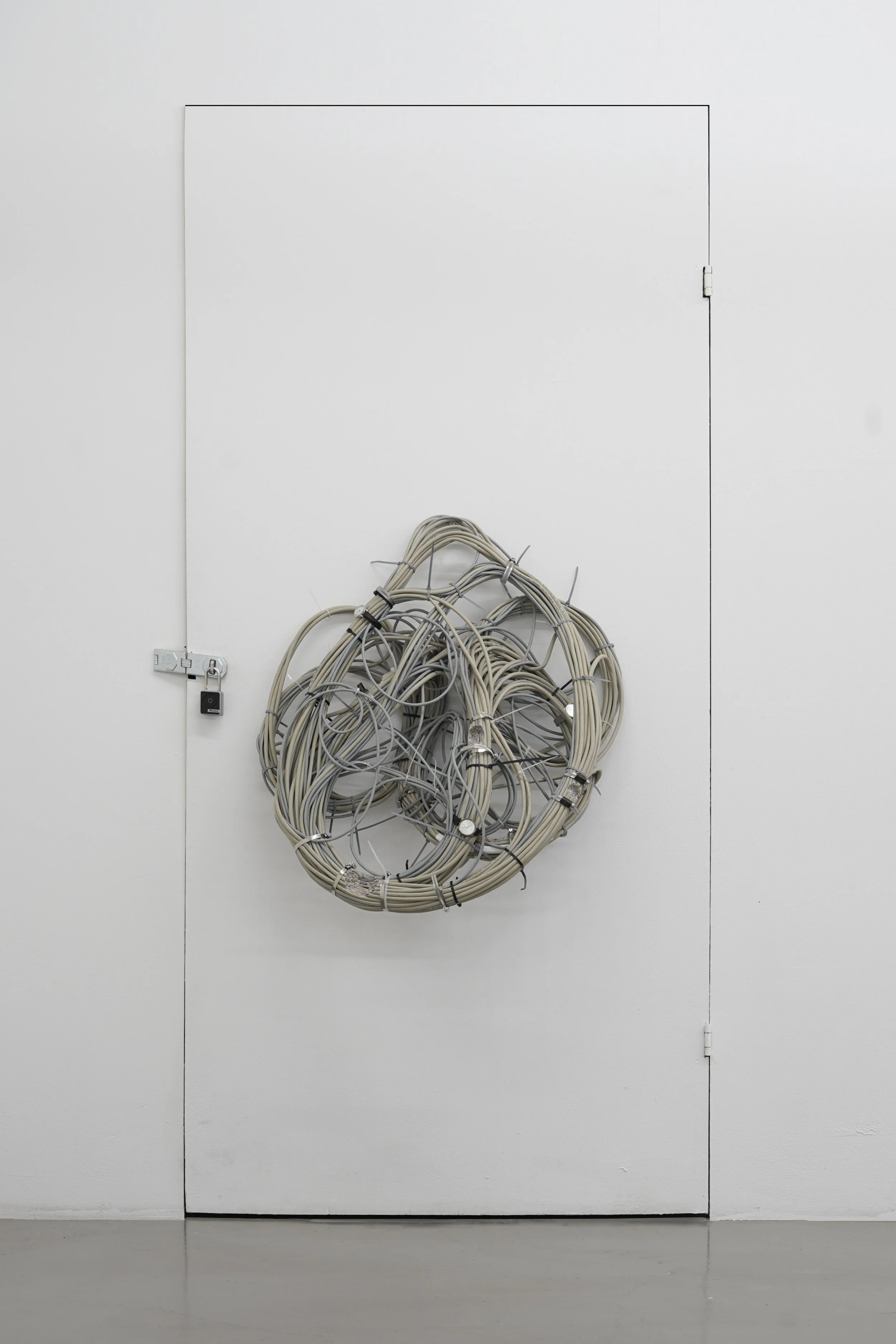 Sculptural work titled “Nest,” made from data cables, wrist watches and clamps, exhibited at Platform Stockholm.