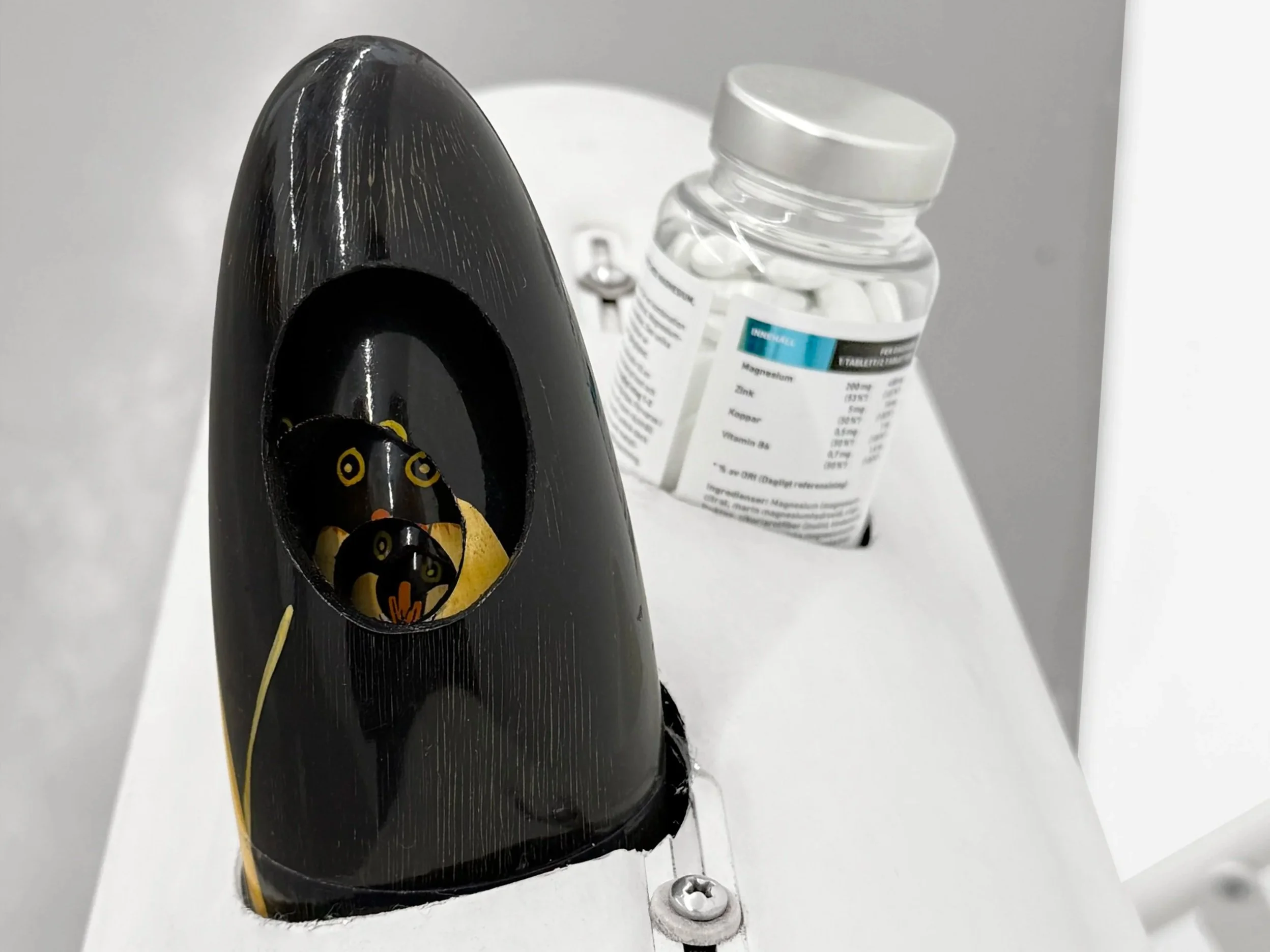 Detail of magnesium pills placed within the sculptural arrangement of “Self-conscious.”