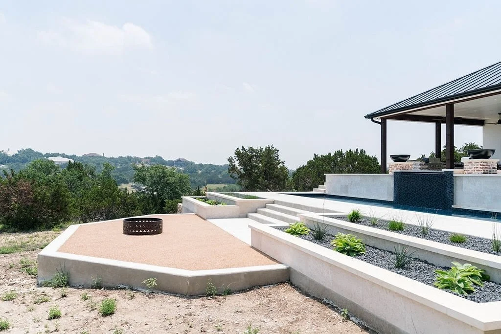 Transform your outdoor space! 🌿🔥

This sleek design features a cozy fire pit and elegant tiered garden beds. Perfect for entertaining in style!

#LandscapeDesign #OutdoorLiving #BackyardBliss #landscaping #NewBraunfelslandscaping #Bulverdelandscapi