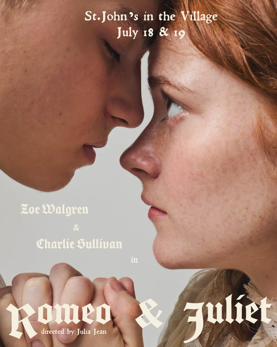 A promotional poster for the play 'Romeo & Juliet' showing a close-up of two young women, one with red hair and freckled skin, and the other with darker skin, touching foreheads with their hands clasped together.