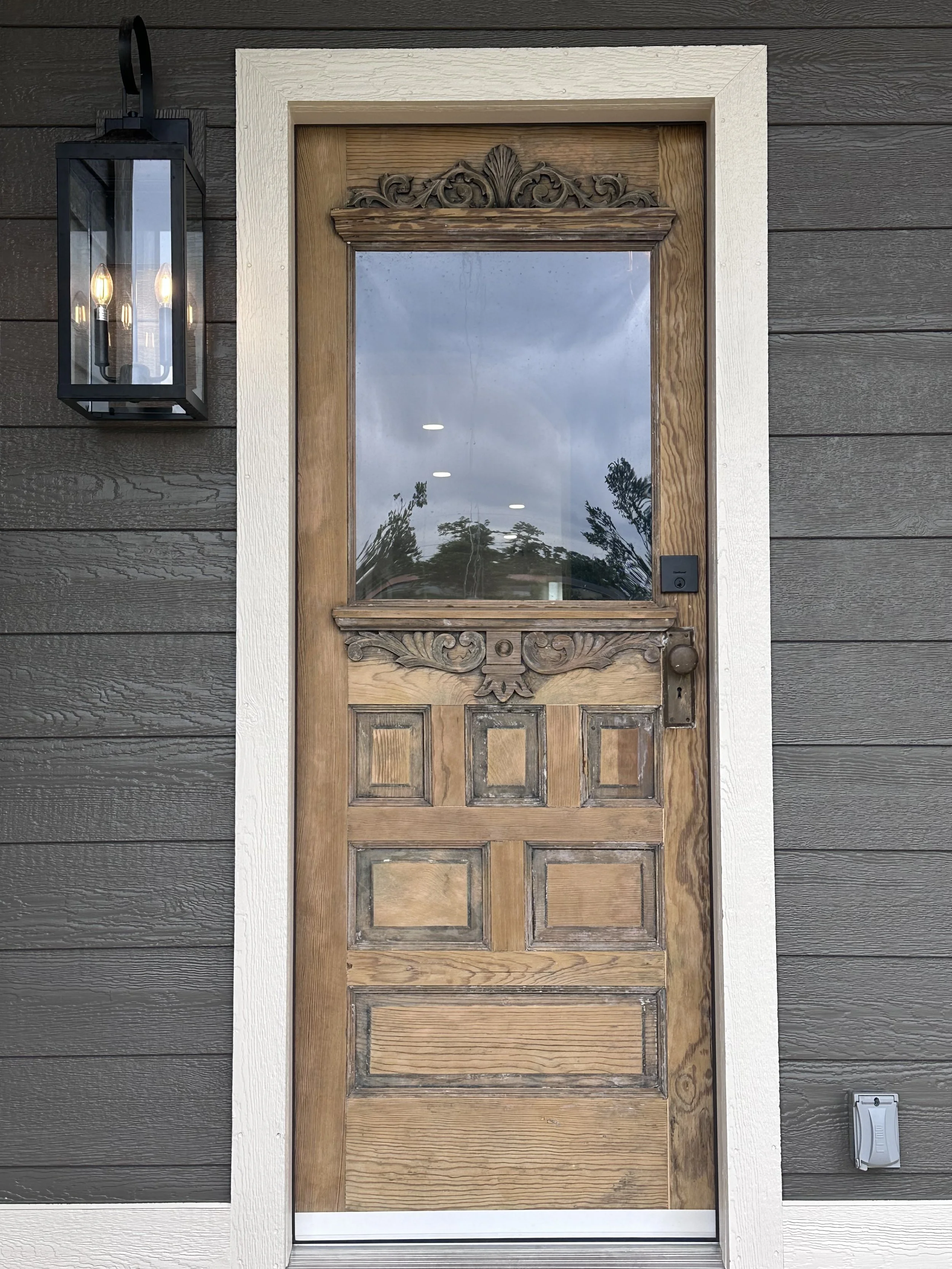 A welcoming, vintage, ornate front door