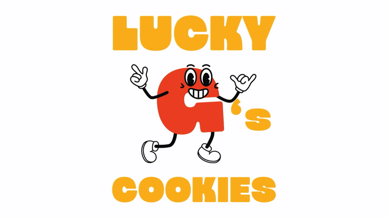 A cartoon red letter 'G' with eyes, mouth, arms, and legs, smiling and making a peace sign with one hand while waving with the other, with the text 'LUCKY G'S COOKIES' in bold yellow letters above and below.