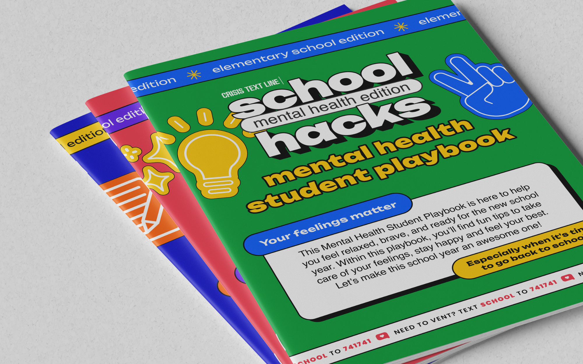 Three colorful educational booklets titled 'School Hacks Mental Health Edition Student Playbook' with bright green, pink, and blue covers, stacked on a light gray surface.