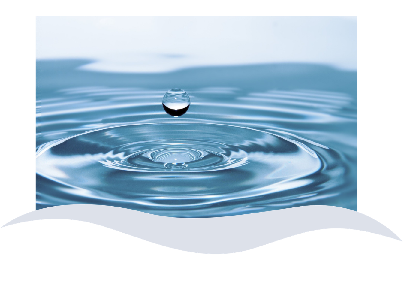 A close-up of a water droplet creating ripples on the surface of the water.