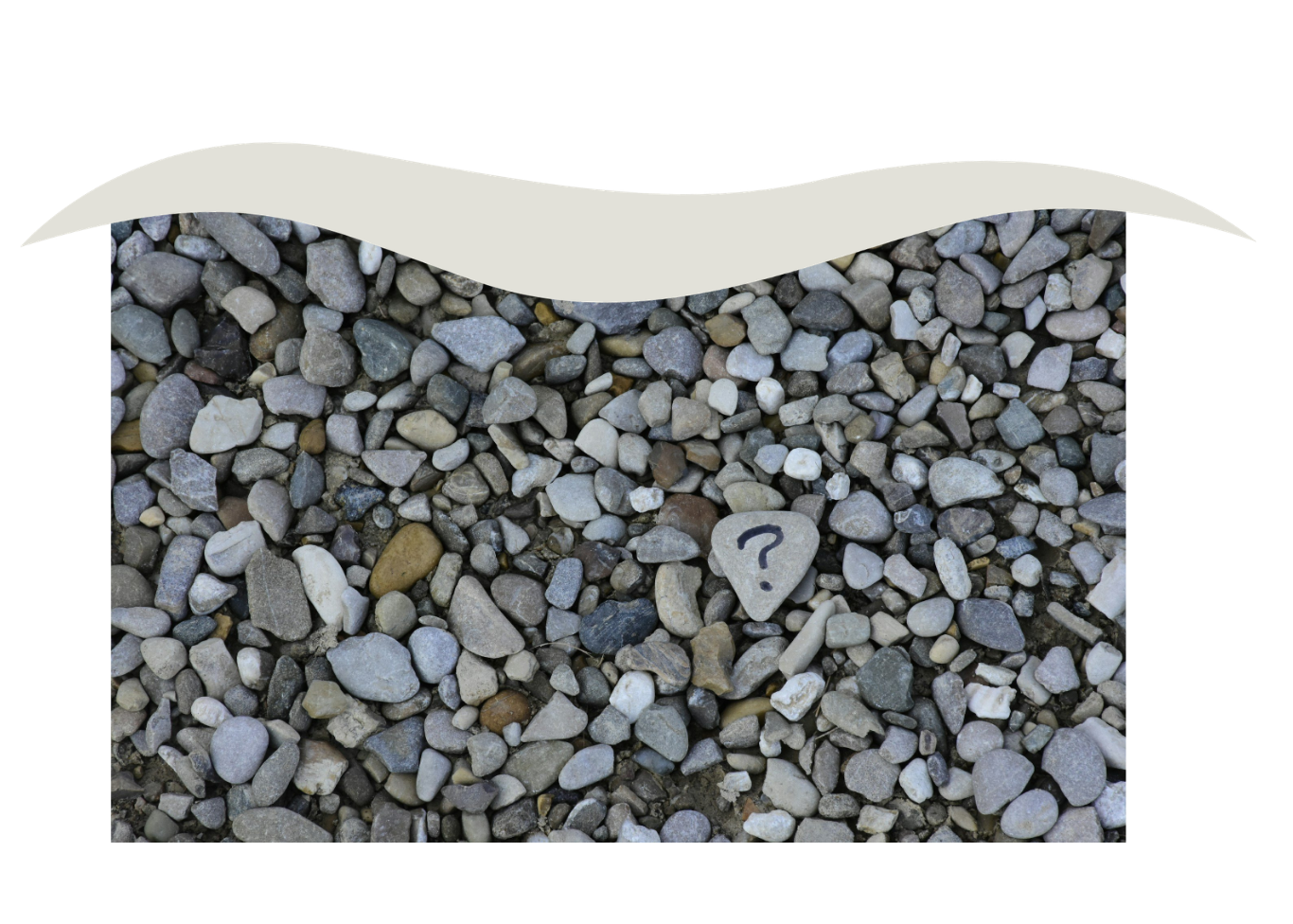 A collection of small, multicolored pebbles with a single stone marked with a black question mark.