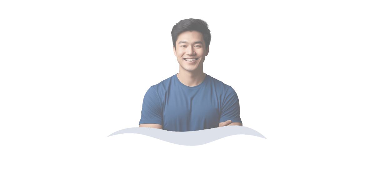 Smiling man with arms crossed, representing the comfort and confidence that comes with feeling accepted for who you are