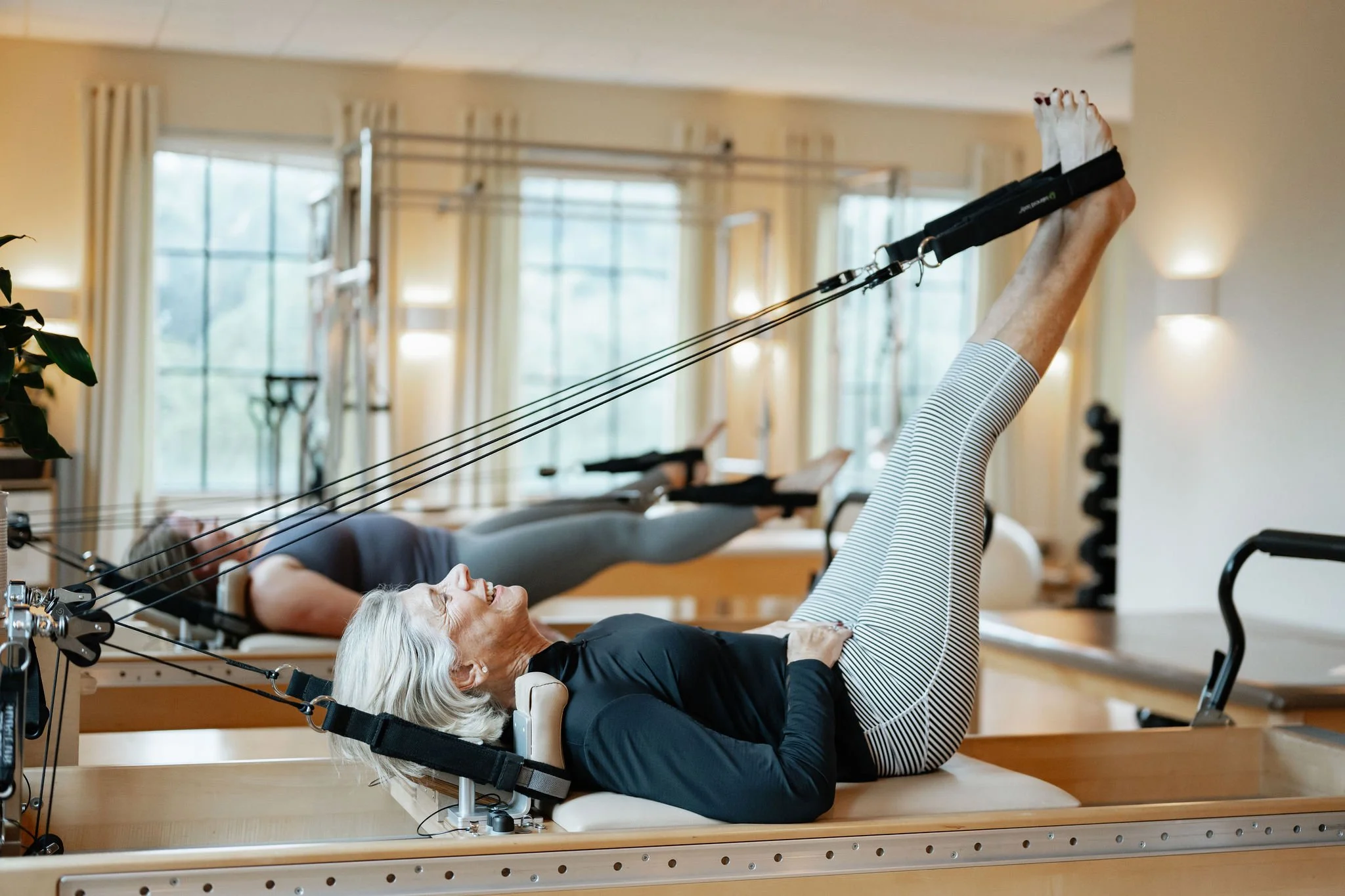 Pilates group reformer class at Core Elements in Jupiter, FL