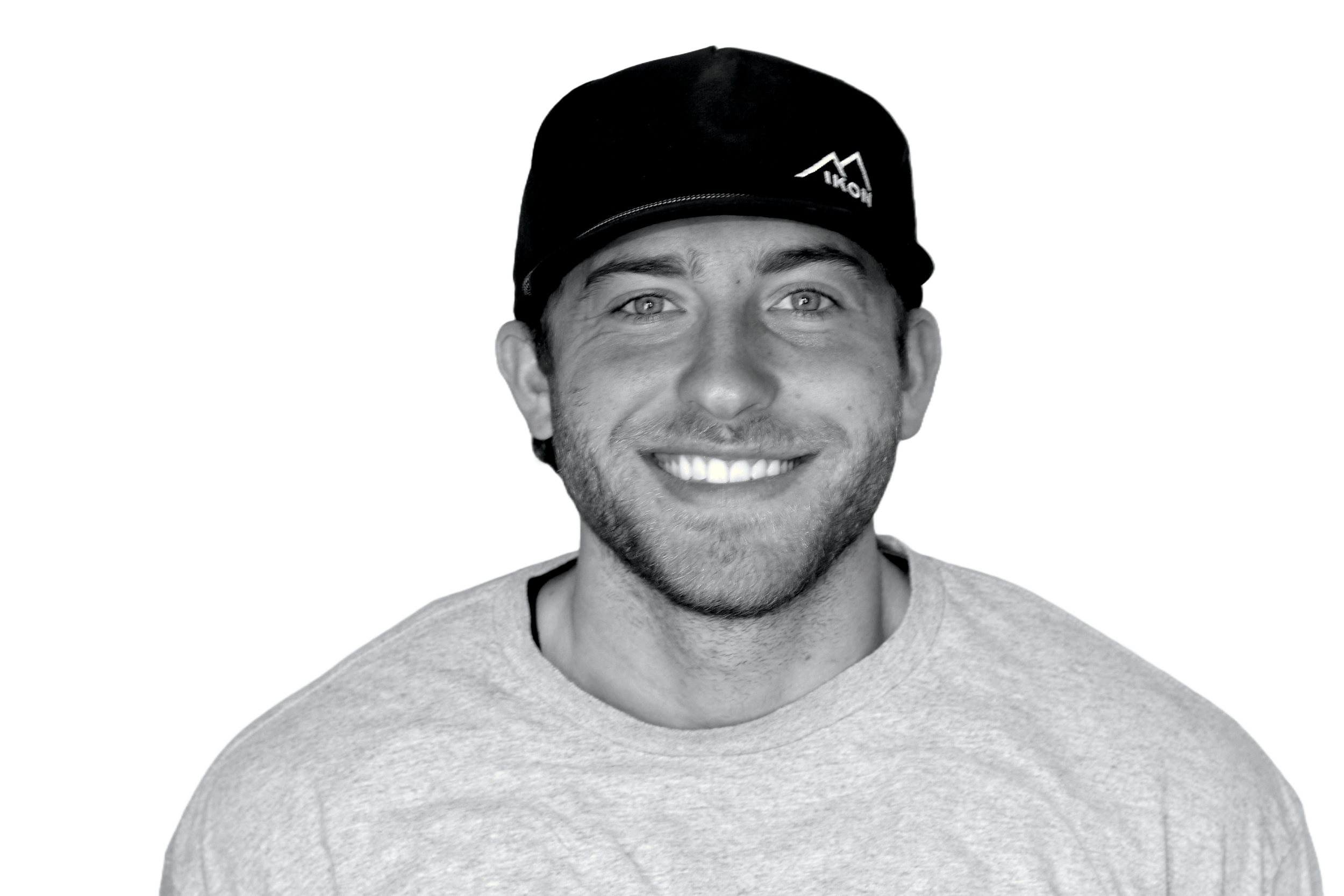 Smiling person wearing an IKON hat and shirt